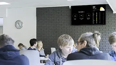 Student cafeteria with an infoscreen on the wall
