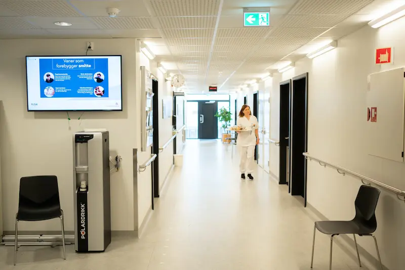 Hospital corridor with info screen